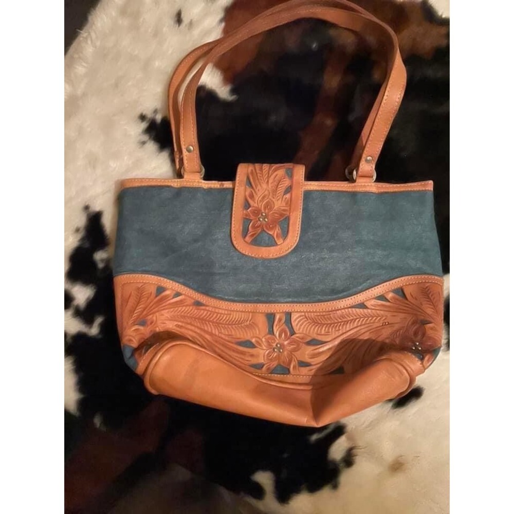 Cute unbranded tooled leather and denim purse. EUC‎ used a week.